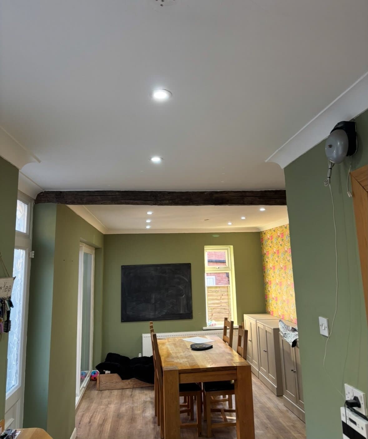 Dining room with new recessed downlights fitted around an exposed timber beam